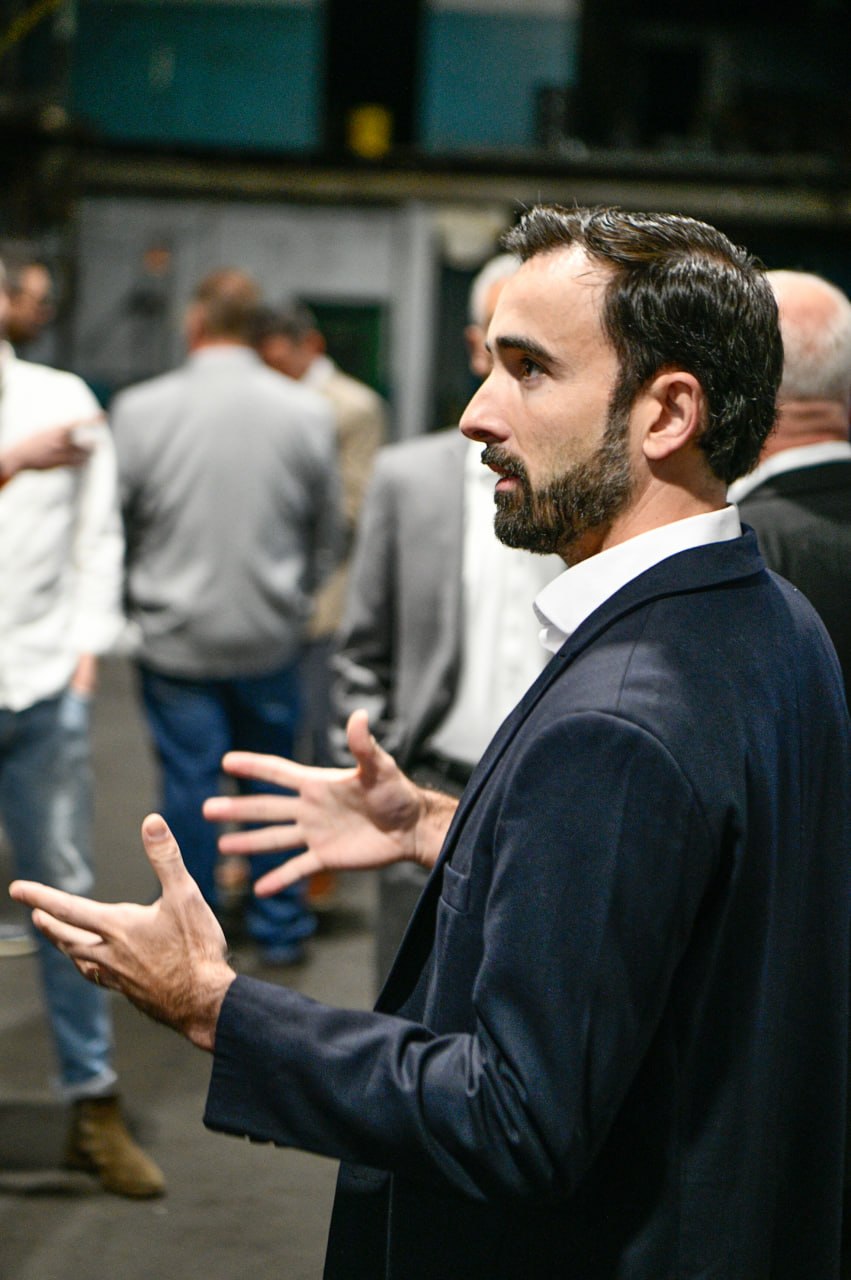 Representative speaking with guests